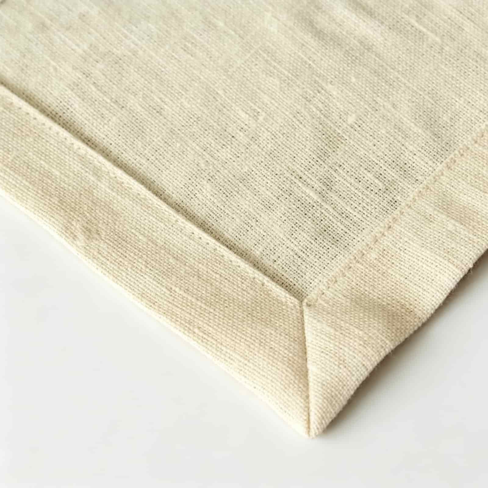 Close-up of blank plain linen cocktail napkins, offering a premium genuine flax alternative to synthetic linen like cocktail napkins.