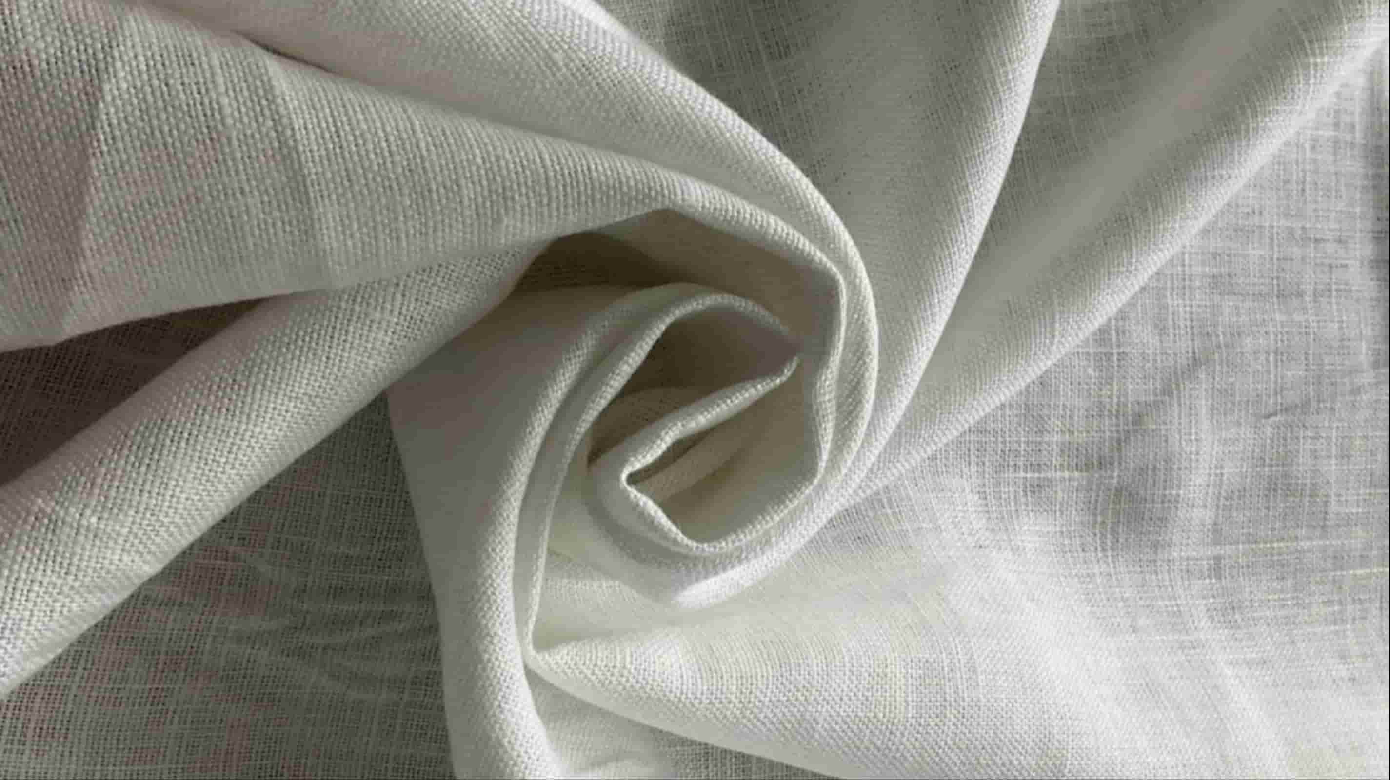 Wholesale linen fabric draped to show softness closeup