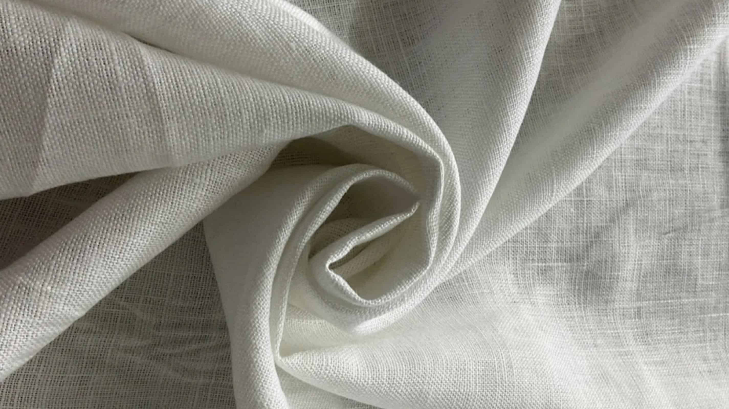 Close-up of authentic European linen fabric showing natural woven texture and matte finish for premium placemats.