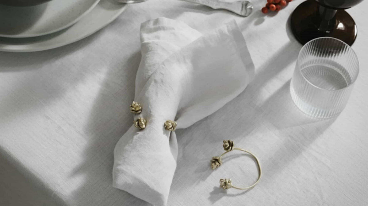 European linen napkins styled with matching placemats and elegant dinnerware for a premium restaurant table.