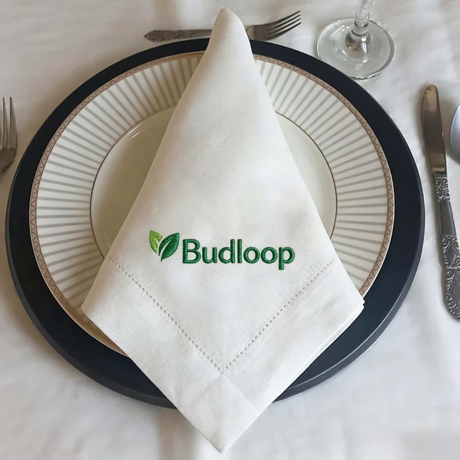 Custom monograms stitched on reusable embroidery cocktail napkins, highlighting a stable and completely flat thread tension.