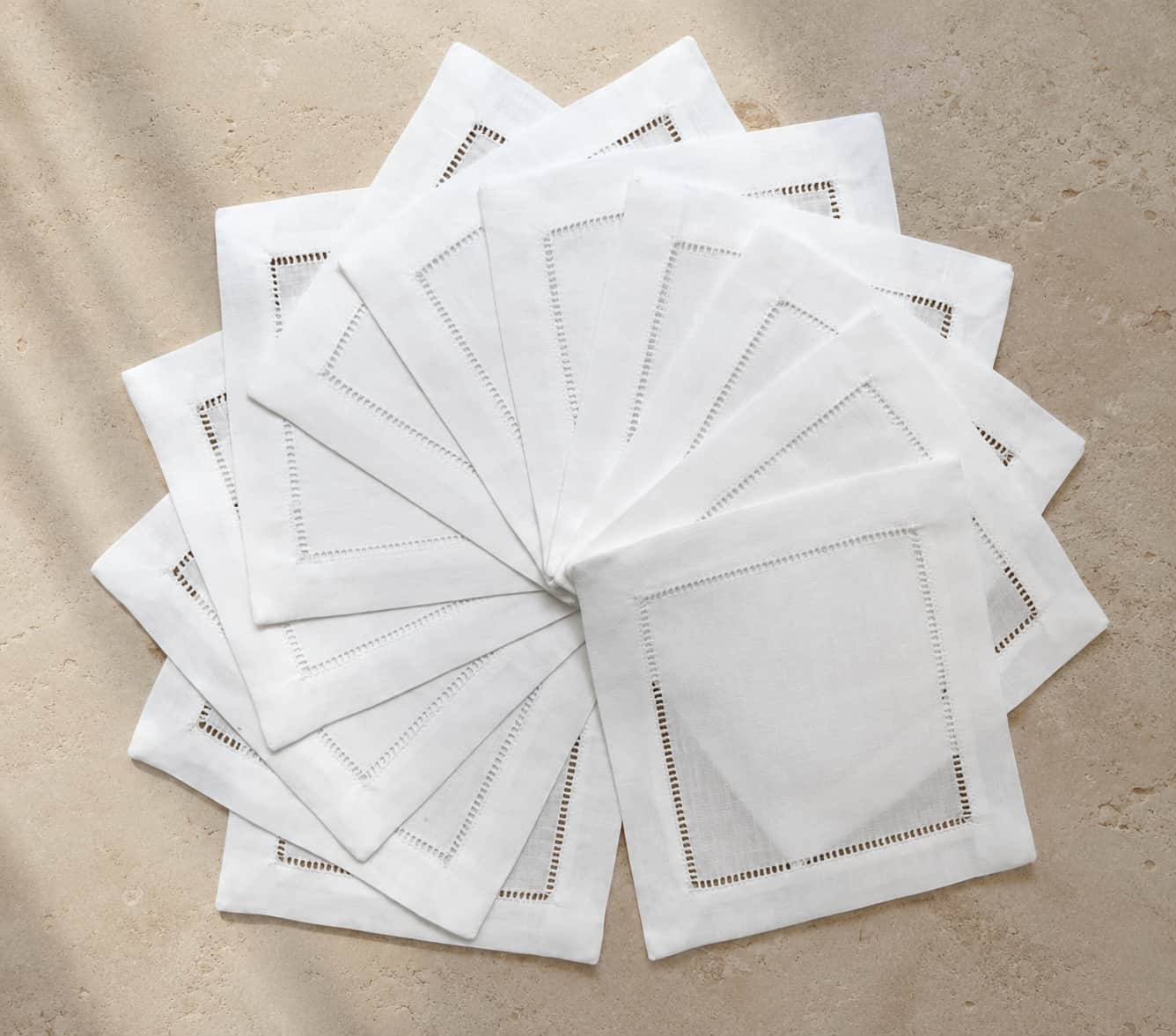 Premium Budloop white linen cocktail napkins serving as a crisp, pristine base blank for high-clarity studio embroidery.